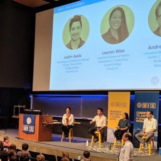 UCSC event showing a student panel on stage