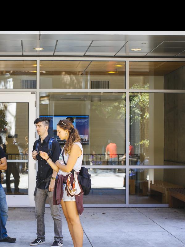 Students outside the Humanities Building on campus