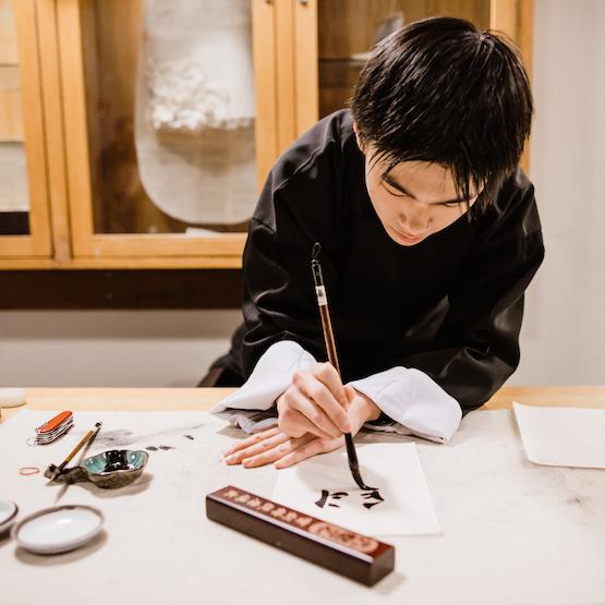 Student doing calligraphy