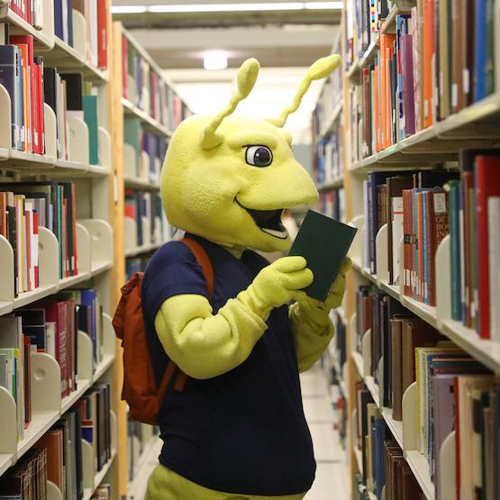 Sammy Slug mascot in library