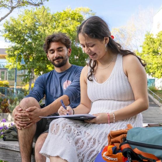 Two students sitting together