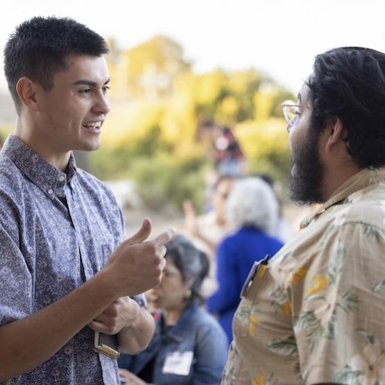 Students talking animatedly to each other