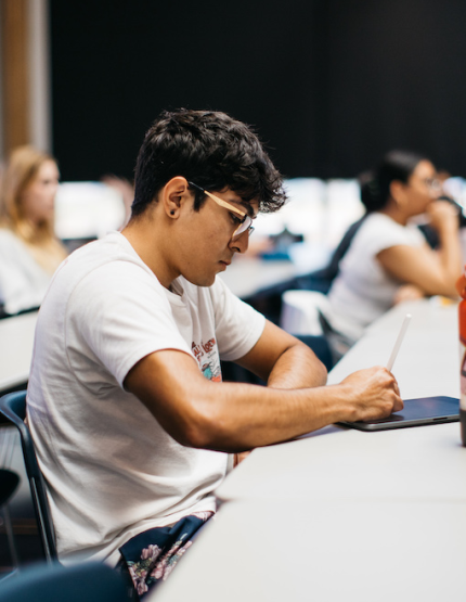 Student on a tablet in class.